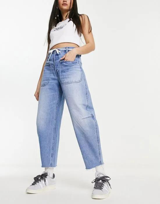 relaxed carrot leg jeans in mid wash