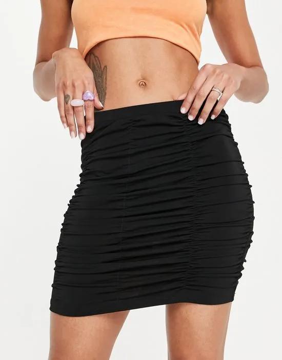 ruched mini skirt in black