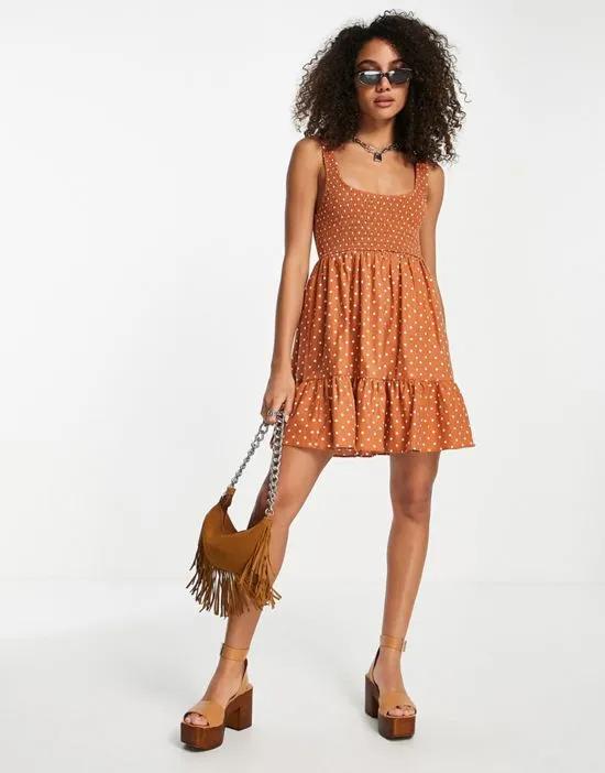 shirred mini sundress with tiers in rust spot print