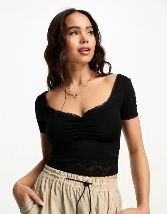short sleeve crop top with lace trim in black