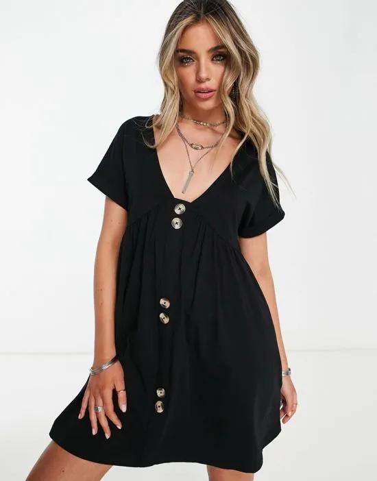 short sleeve mini smock dress with large button detail in black
