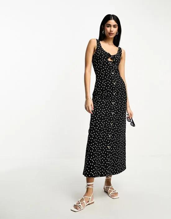 sleeveless midi dress with buttons and tie detail in black spot