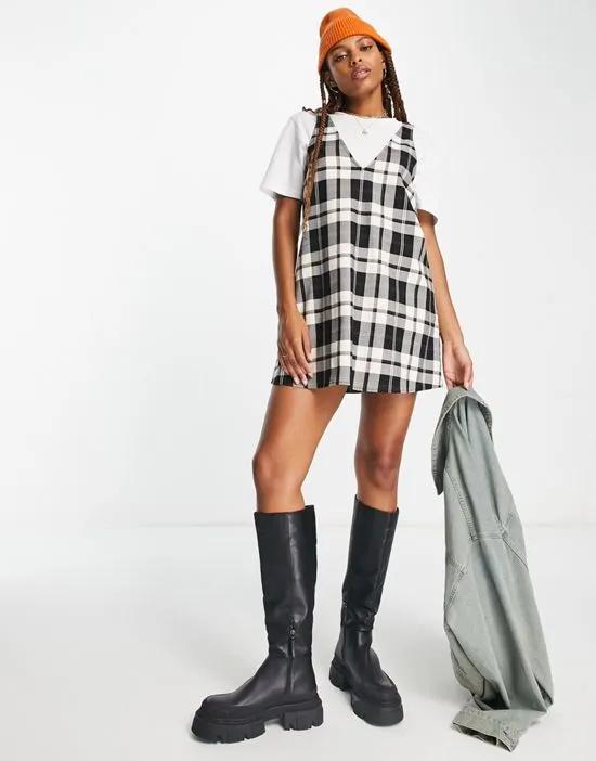 sleeveless mini dress in black and off white check