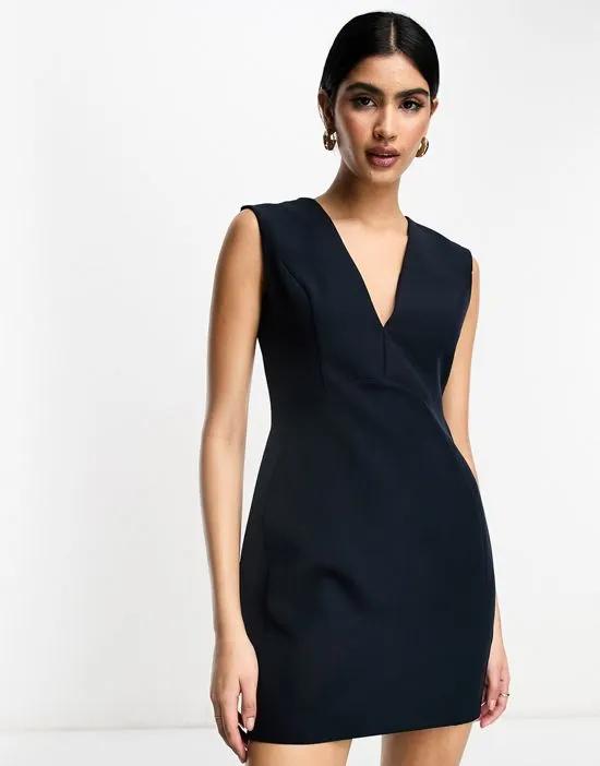 sleeveless plunge neck mini dress with curved waist seam in navy