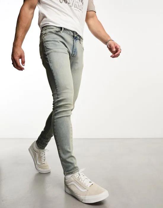 spray on jeans with power stretch in mid wash tint