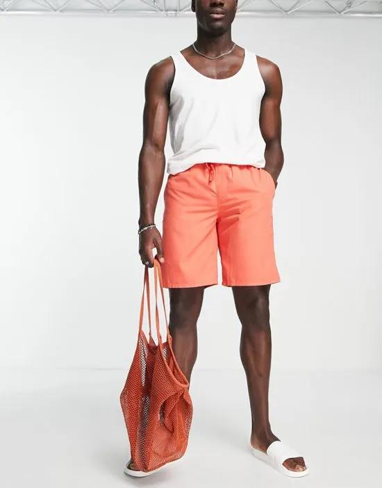 swim shorts in long length in red