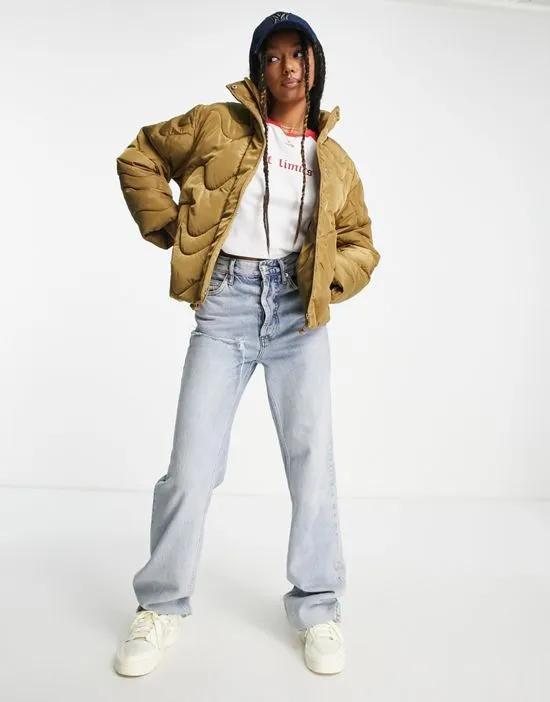 swirl quilted puffer jacket in camel