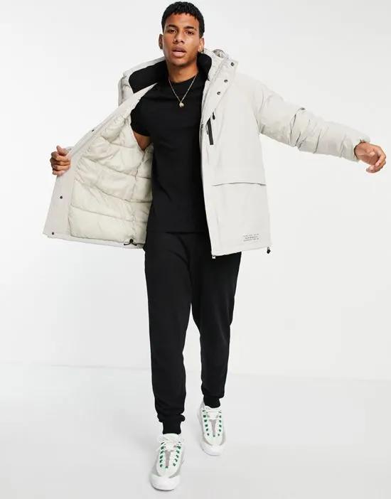 tech short parka in stone