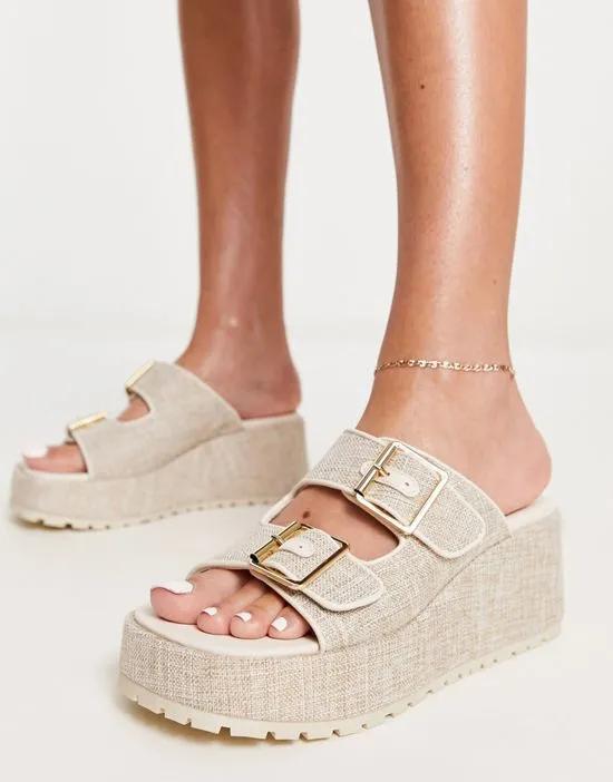 Tennesse buckle detail wedge mules in natural