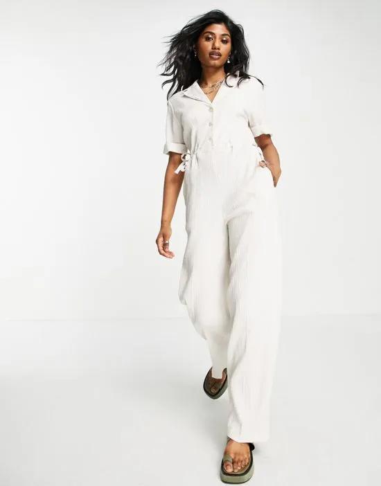 textured button up drawstring jumpsuit in sand
