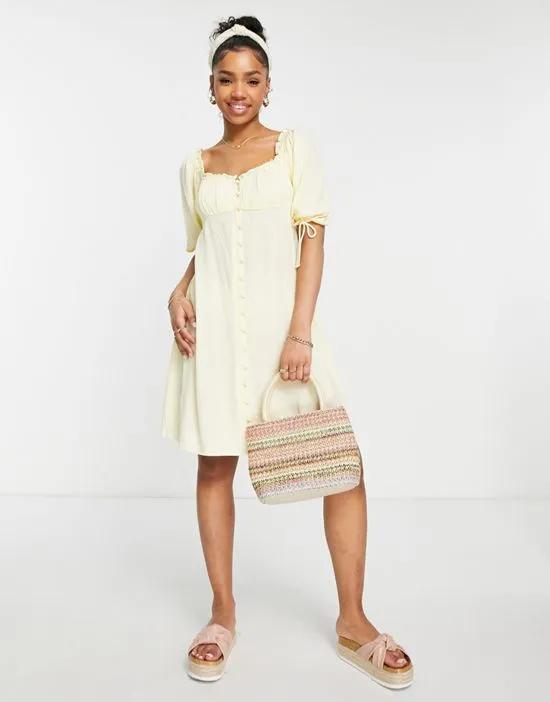 textured button up fit and flare mini dress in lemon