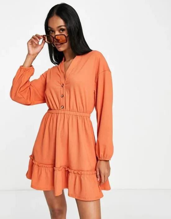 textured long sleeve waisted mini shirt dress with tier hem in orange