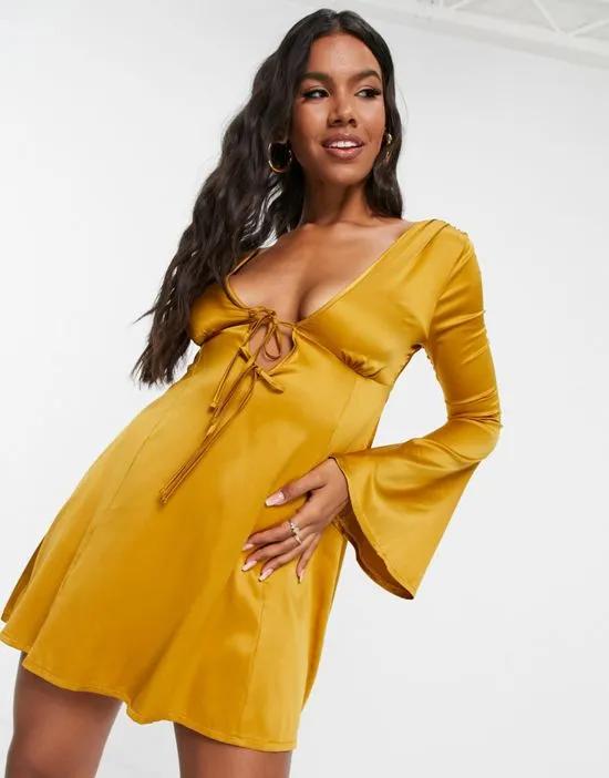 tie front fit and flare mini skate dress in gold