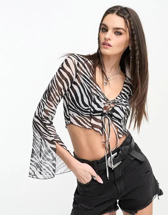 top with lace up detail & piping in zebra print