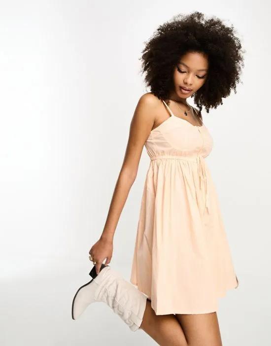utility cup detail babydoll mini sundress with zip detail in washed peach