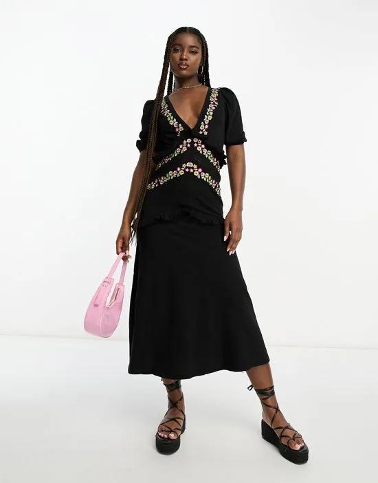 v neck midi dress with frill detail and embroidery in black