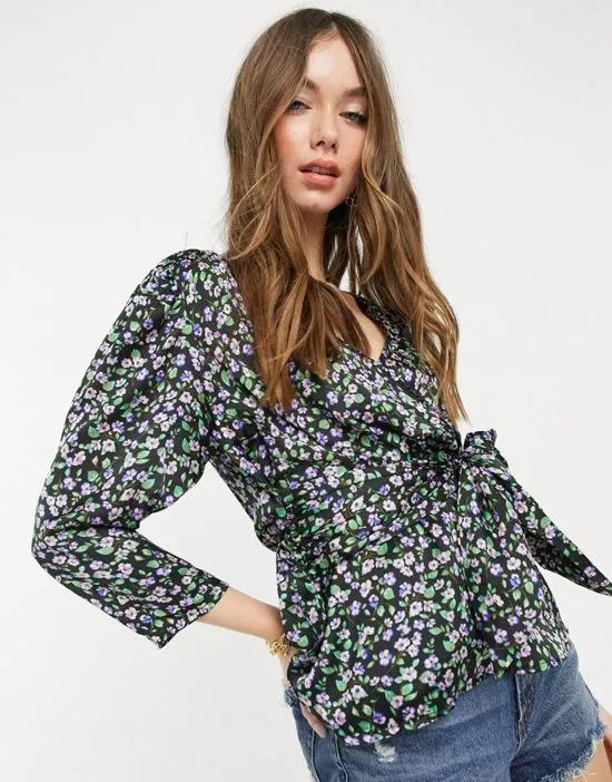 wrap blouse with puff sleeves and deep cuffs in purple floral