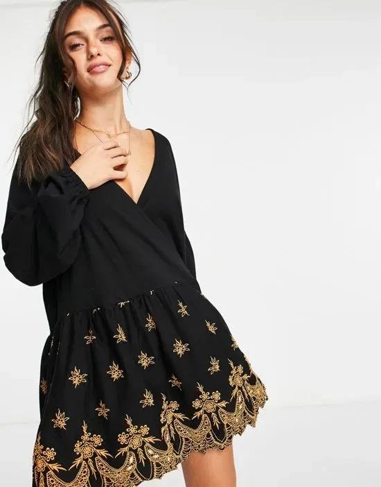 wrap dress with gold cutwork embroidery detail in black