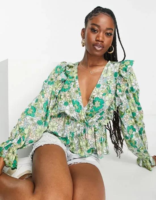 wrap top with scallop peplum hem in green floral print
