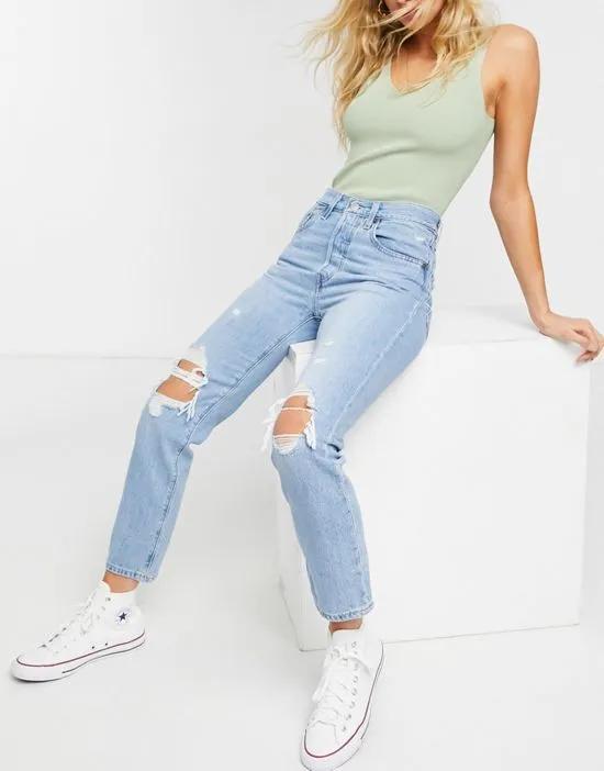 501 high rise rip knee straight leg crop jeans with rips in light was blue