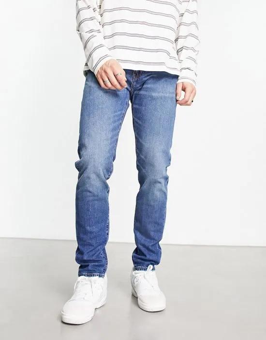 512 slim tapered jeans in midwash blue