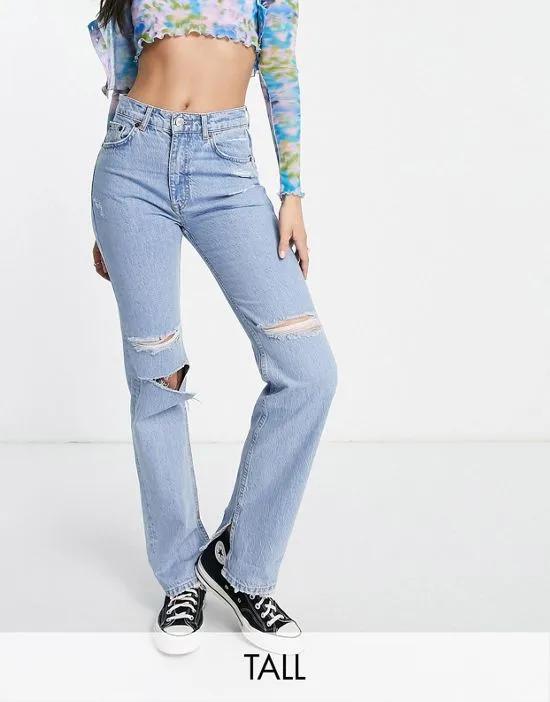 90s high waist straight leg jeans with rips and slit hem in blue