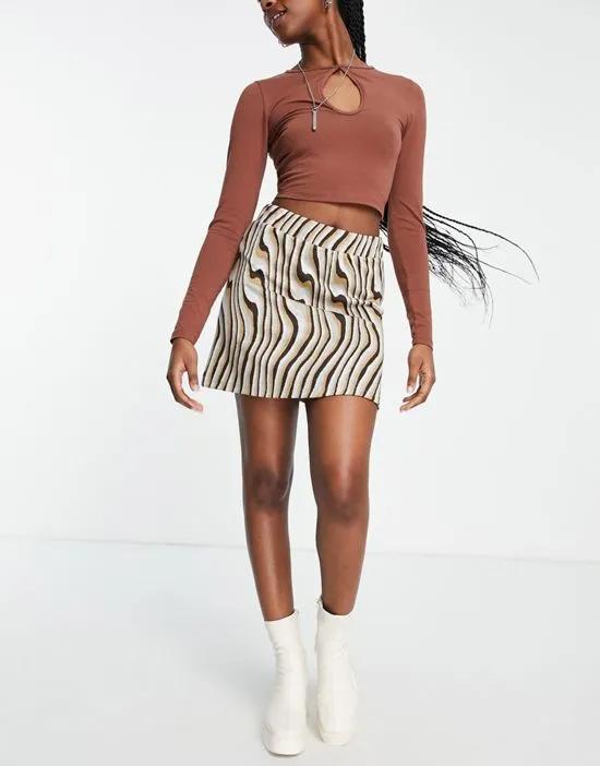 a line mini skirt in 70s swirl jacquard print