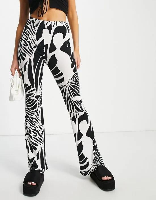 abstract wing print flare pants in cream