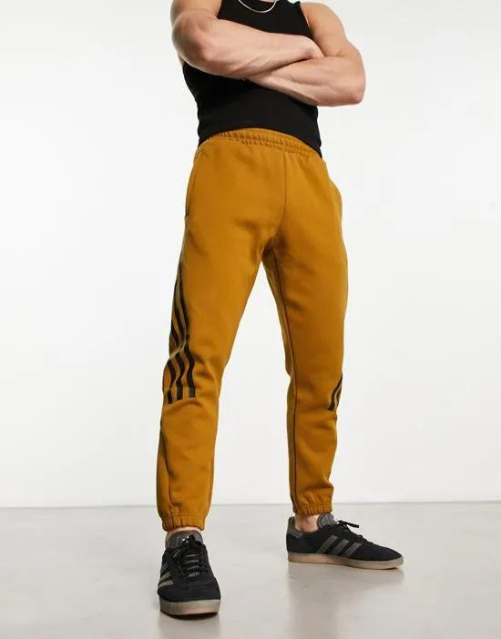 adidas Sportswear Future Icons 3 stripes sweatpants in dark orange