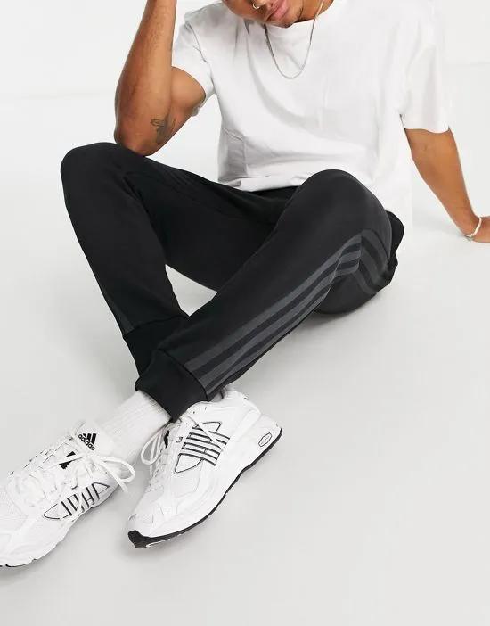 adidas sweatpants with three stripes in black