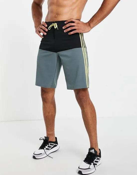 adidas training 3 stripe color block board shorts in black and blue