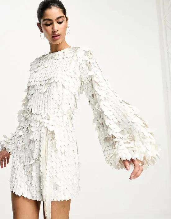 all over feather sequin embellished long sleeved mini dress in white