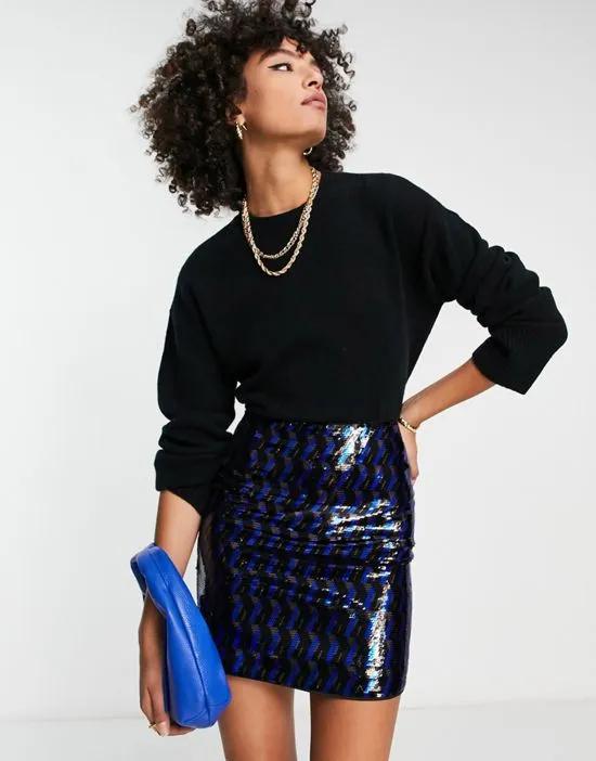 all-over sequin mini skirt in blue and black geometric