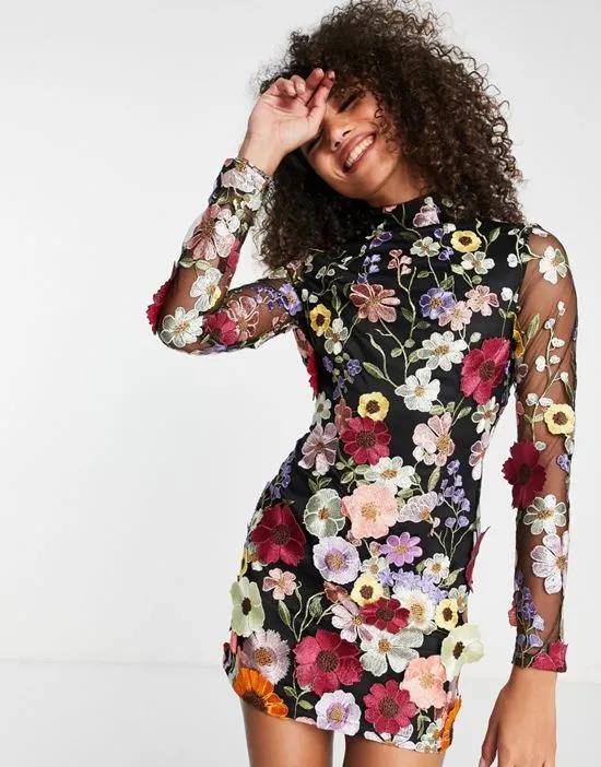Amy Lynn backless mini dress in black based floral embroidery