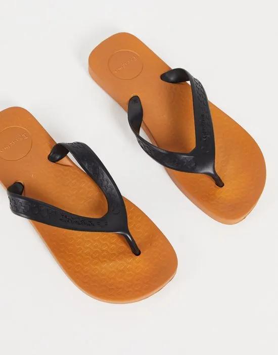 anatomic surf flip flops with contrast sole in black