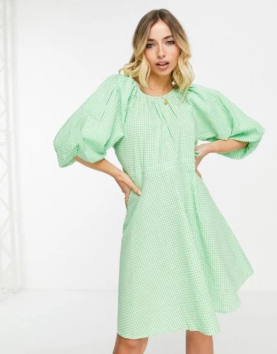 angel sleeve mini dress in green polka dot