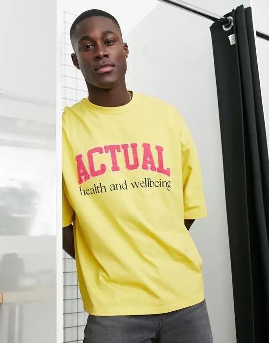 ASOS Actual oversized T-shirt with boucle 'health & wellbeing' logo in yellow