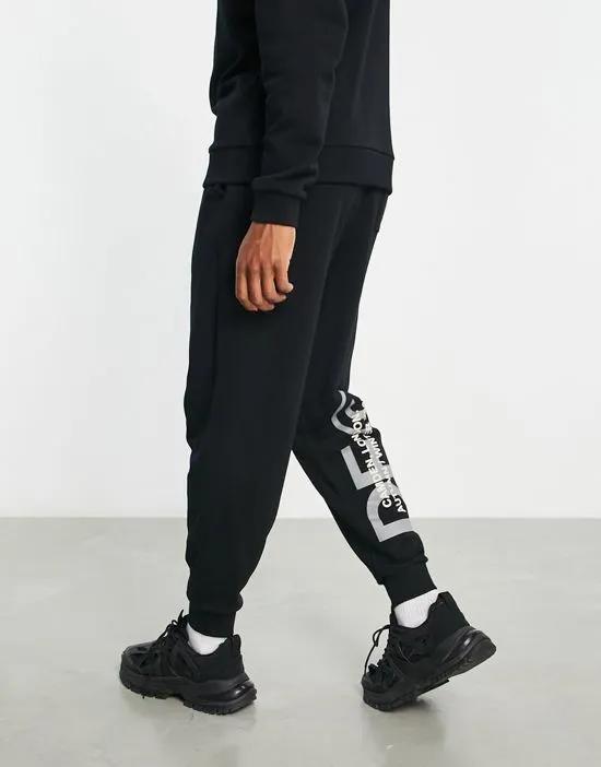 ASOS Dark Future relaxed sweatpants with logo print in black - part of a set