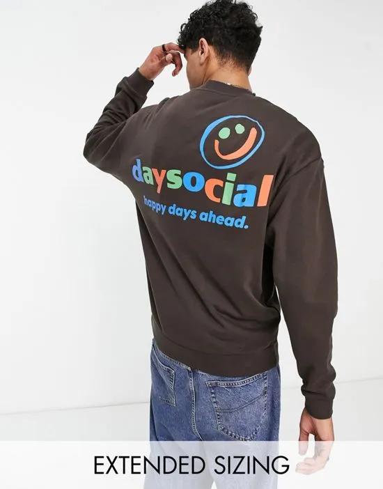 ASOS Daysocial oversized sweatshirt with multi color logo front and back prints in brown