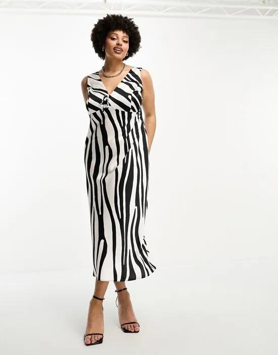 ASOS DESIGN Curve bias satin tie detail midi dress in abstract zebra print