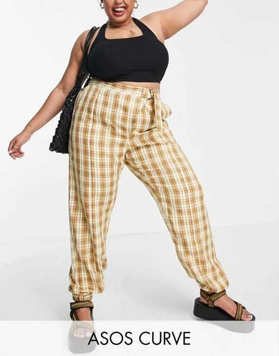 ASOS DESIGN Curve peg pants with asymmetric fly and front seam detail in check