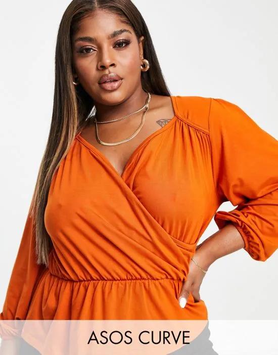 ASOS DESIGN Curve wrap top with peplum hem