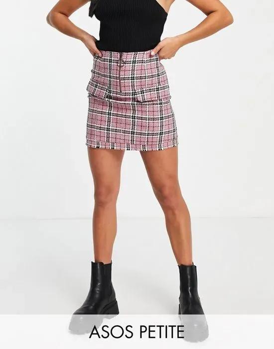 ASOS DESIGN Petite boucle mini skirt with raw hem and pocket detail in pink check print