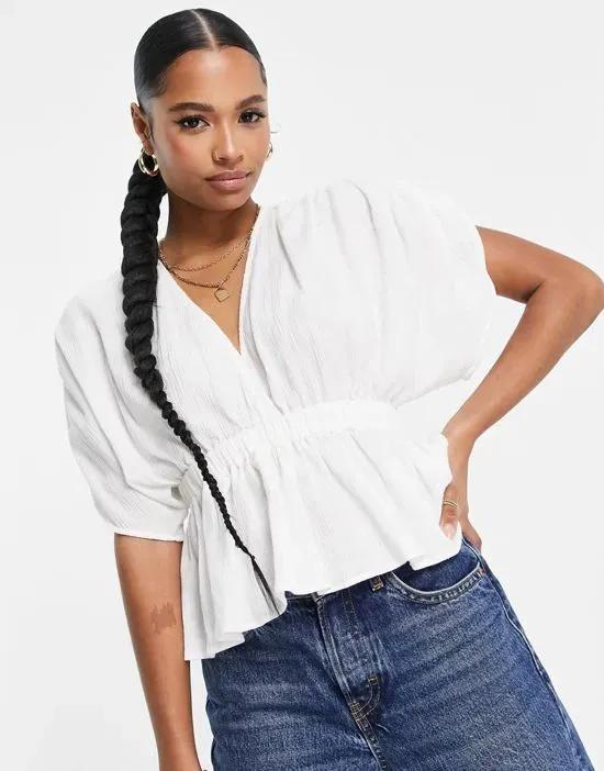 ASOS DESIGN Petite textured plunge front top with elastic waist detail in white