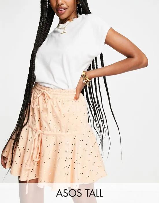 ASOS DESIGN Tall broderie tiered mini skirt with tie detail in apricot