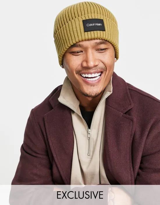 ASOS exclusive beanie with rubber patch in camel