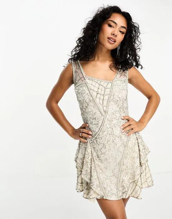 beaded mini dress with layered skirt and linear embellishment detail in blush