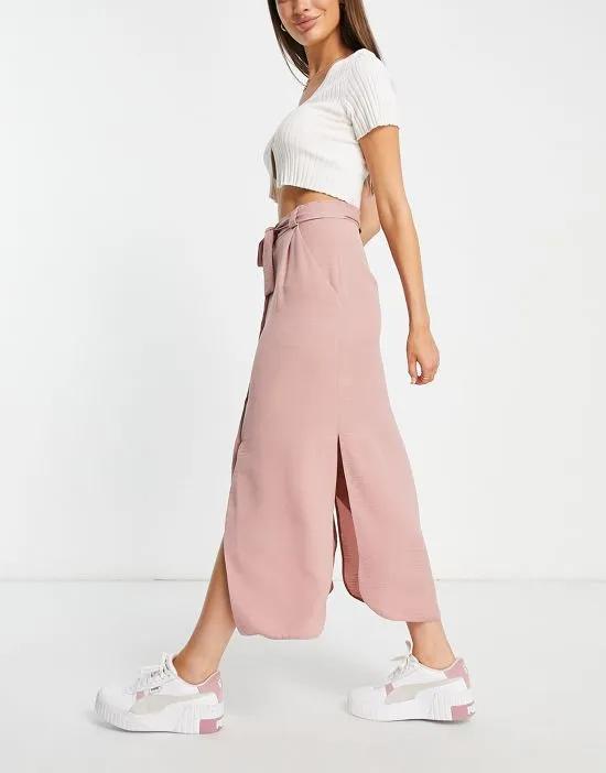 belted button through midi skirt in pink