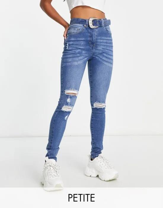 belted skinny jeans in mid blue