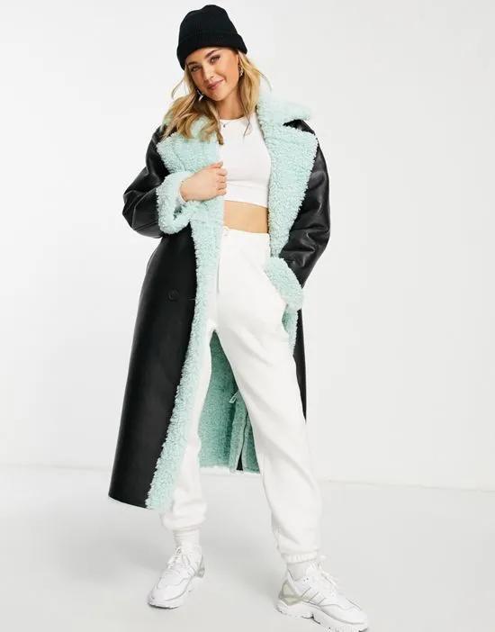 bonded borg trench coat in black and mint
